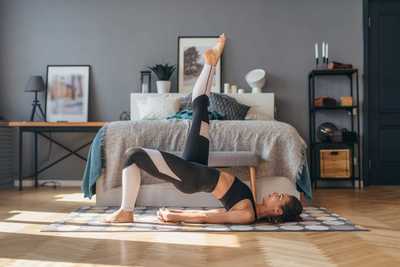 Woman performing glute bridge for back pain relief