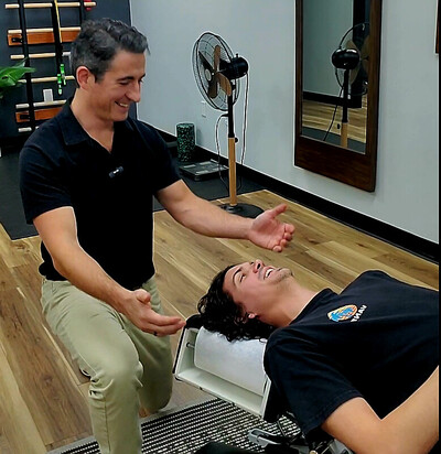 Chiropractic adjustment being performed for neck pain relief and headaches