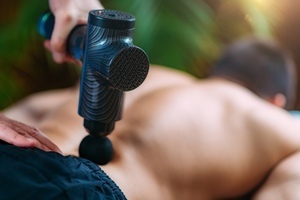 man getting shockwave soft tissue treatment